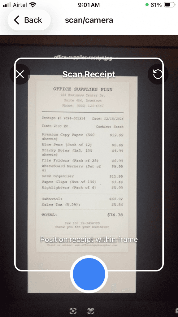 Mobile phone scanning a paper receipt using receipt scanner app - capture step for digitizing expenses with OCR and AI